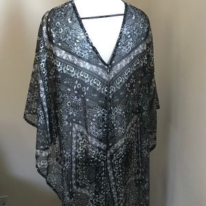 This lovely flowers poncho so flowing, versatile.